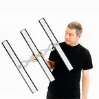ARAY 3 Grow Light. Man holding four LED light bars against a white background