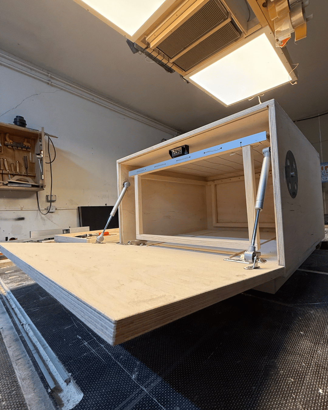 DryBox, a drying box for herbs opened up. To see a wooden frame to apply the herbs to.