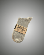 Gray hemp socks with a label on a gray background