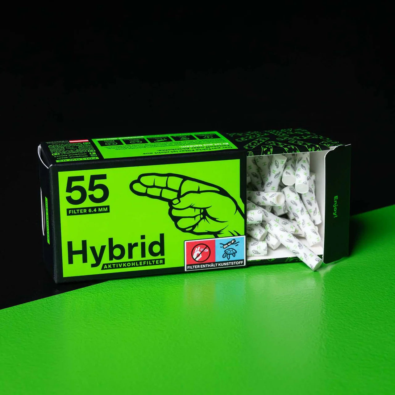 Box of hybrid filters with green and black design on a green surface