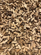 Close-up of a large pile of wooden filters with visible TIPZZ branding.